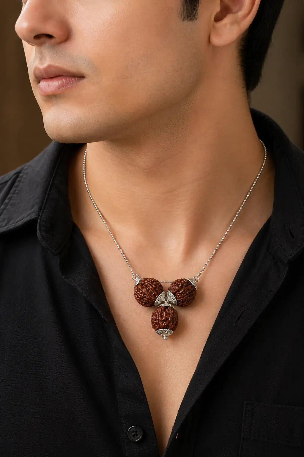 Professional wearing original Vyapar Vriddhi Rudraksha Kavach pendant for success and financial attraction - Tathastu Gems