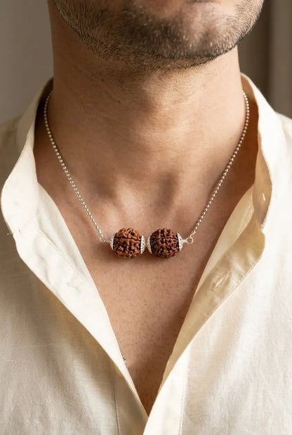 Person wearing original Sade Sati Kavach pendant for protection against Shani Dhaiya and negative energy - Tathastu Gems