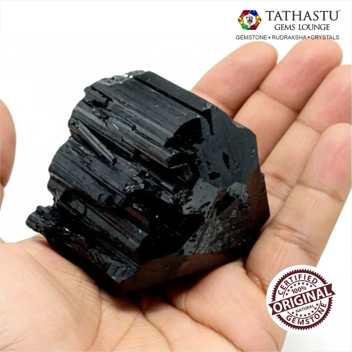 Unpolished natural Black Tourmaline rough chunk held in palm showing authentic raw crystal texture and size - Tathastu Gems