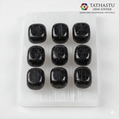 Set of original Black Tourmaline Tumble stones arranged in a grid for stability, EMF protection, and home Vastu balance - Tathastu Gems