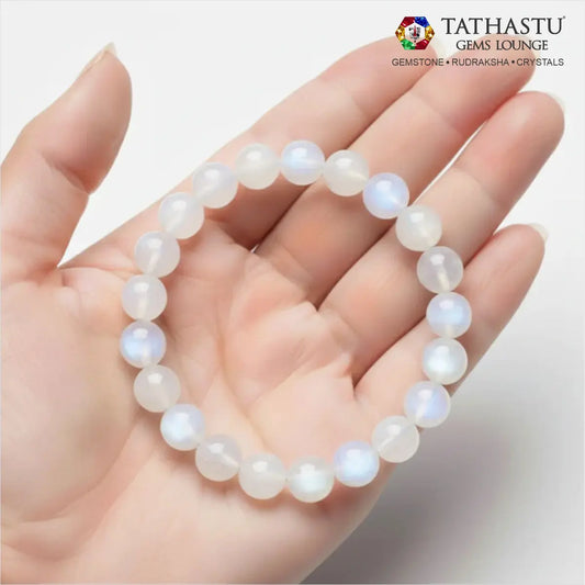 Authentic Original Moonstone Bracelet at Tathastu Gems Lounge held on an open palm displaying gentle blue sheen and white sheen beads.