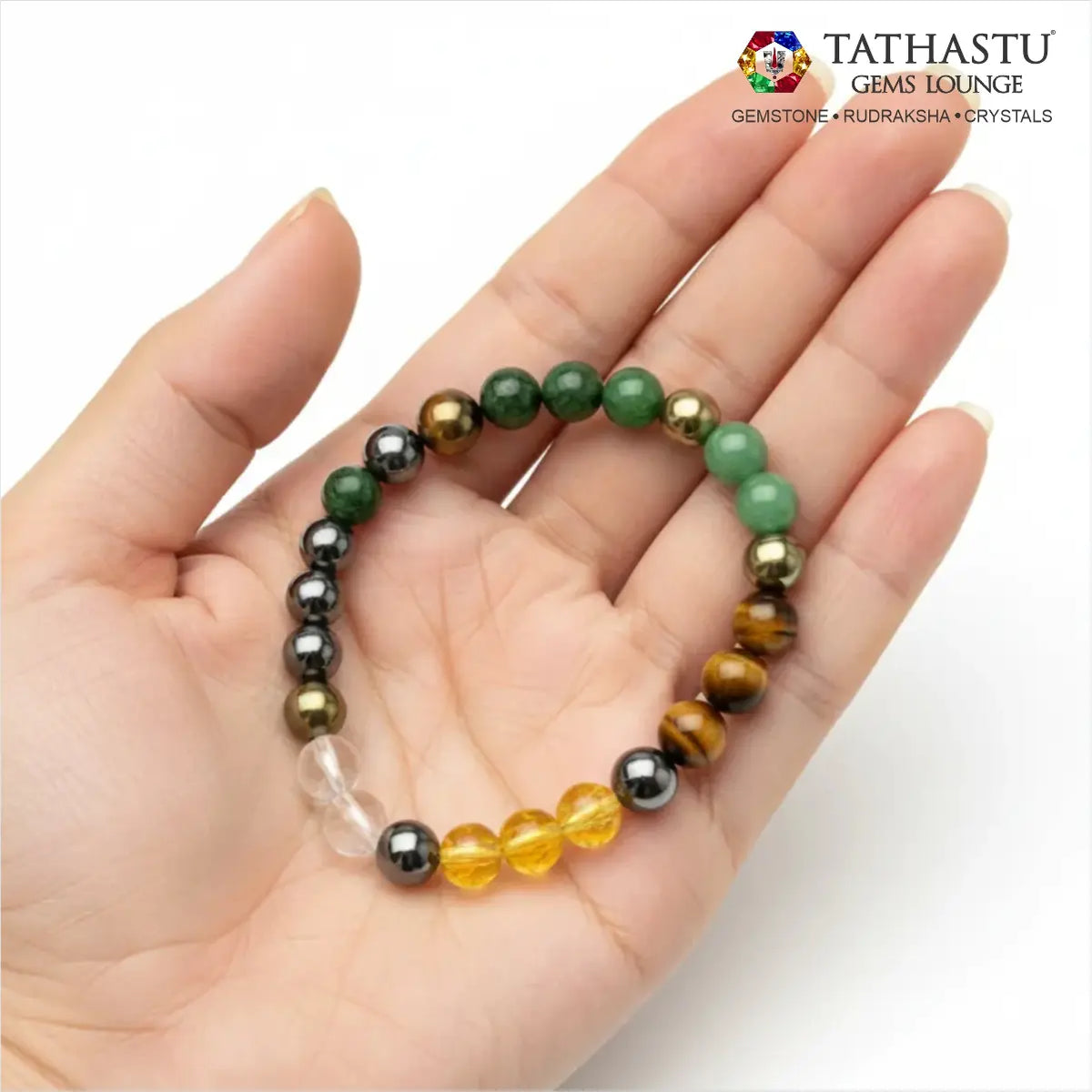 Authentic Original Dhanyog Bracelet at Tathastu Gems Lounge held on an open palm showing Green Aventurine, Tiger Eye, Citrine, and Pyrite beads.