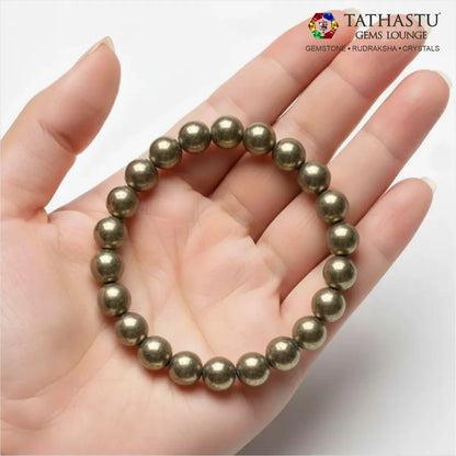 Authentic Original Pyrite Bracelet at Tathastu Gems Lounge held on an open palm displaying rich metallic luster golden-pyrite beads.