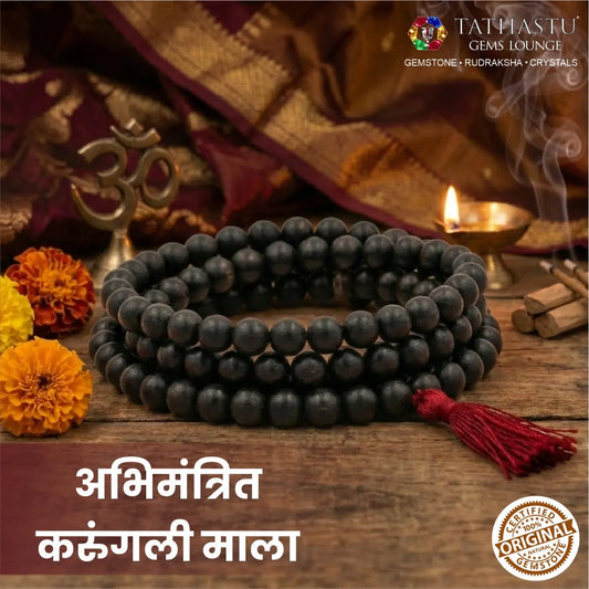Abhimantrit original Karungali Malai with red tassel in traditional pooja setting - Tathastu Gems