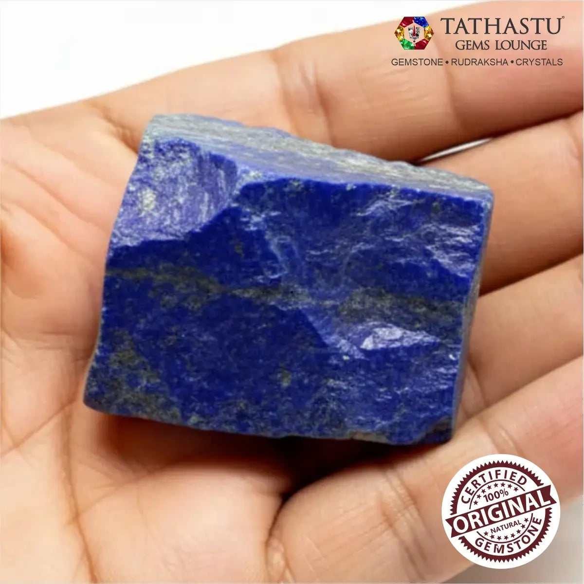 Unpolished natural Lapis Lazuli rough chunk held in palm showing authentic deep blue texture with golden pyrite flecks - Tathastu Gems