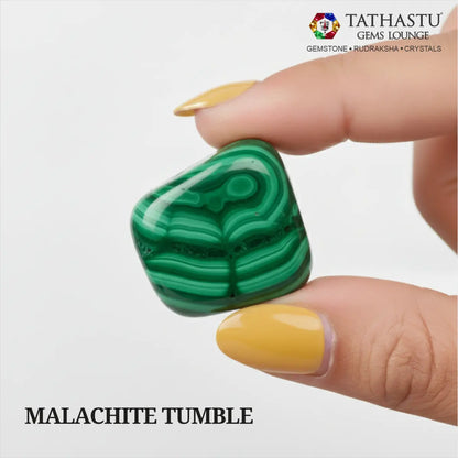 Natural polished Malachite Tumble stone held in hand for positive energy transformation, growth, and Heart Chakra balance - Tathastu Gems Lounge