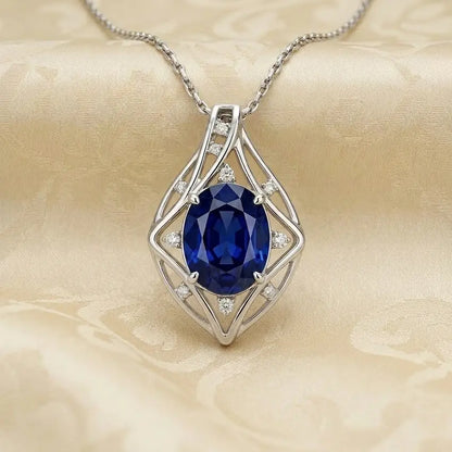 Elegant oval cut Blue Iolite gemstone set in silver pendant design for Saturn astrological remedy - Tathastu Gems