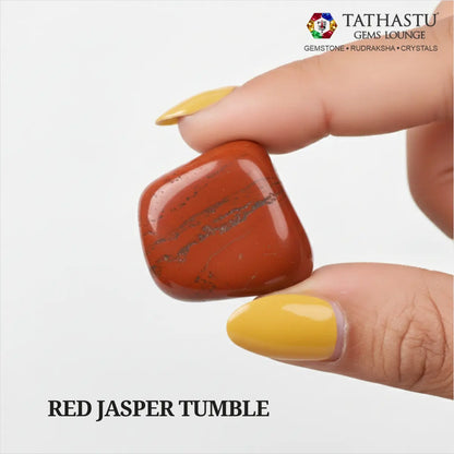 Natural polished Red Jasper Tumble stone held in hand for courage, emotional stability, and Root Chakra grounding - Tathastu Gems Lounge