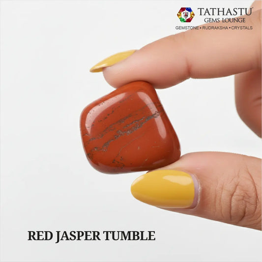 Natural polished Red Jasper Tumble stone held in hand for courage, emotional stability, and Root Chakra grounding - Tathastu Gems Lounge