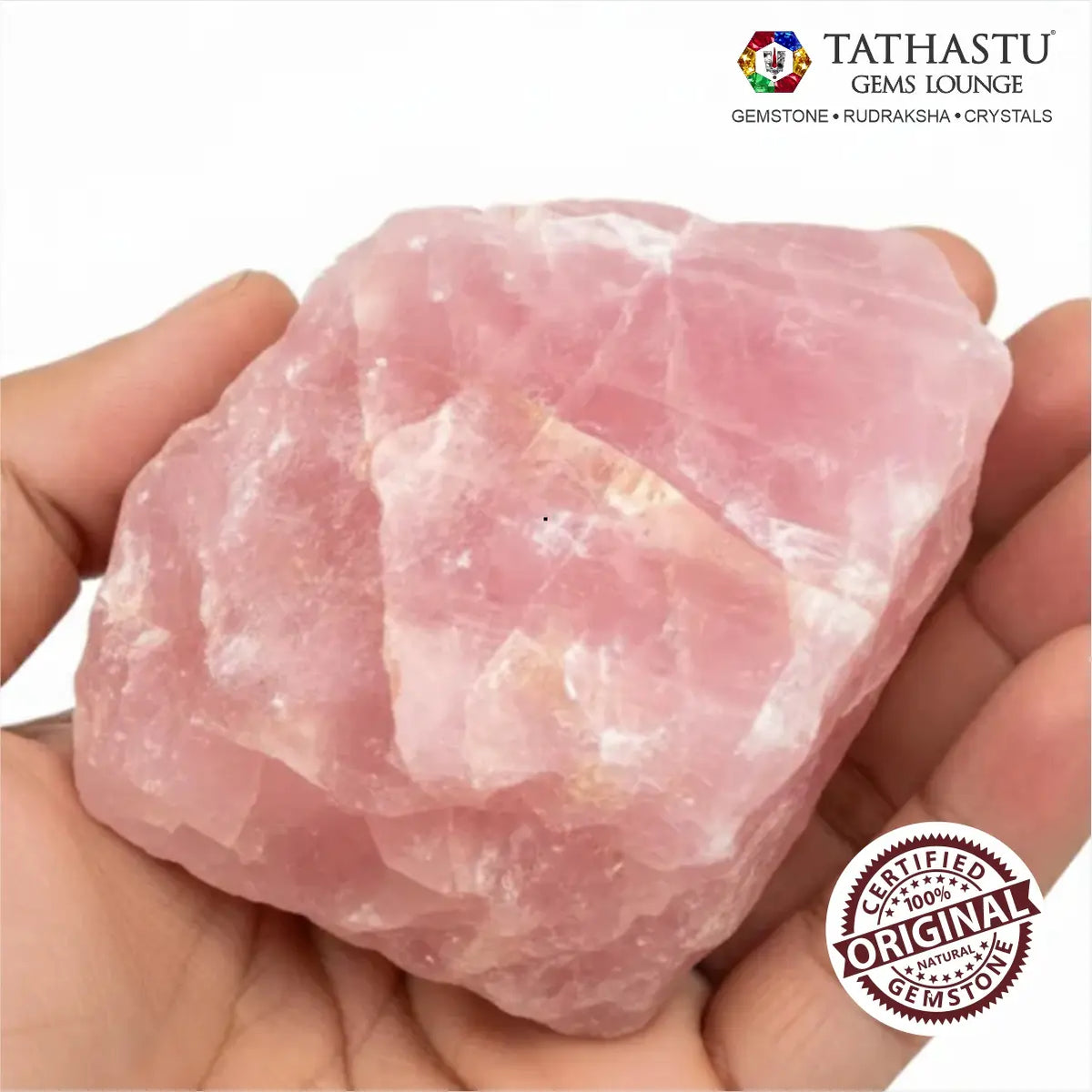 Unpolished natural Rose Quartz rough chunk held in palm showing authentic pink crystal texture and size - Tathastu Gems
