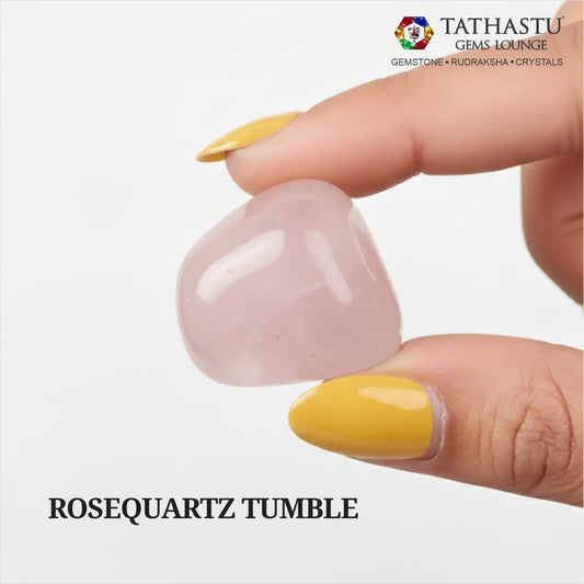 Natural polished Rose Quartz Tumble stone held in hand for attracting love, emotional healing, and Heart Chakra balance - Tathastu Gems Lounge